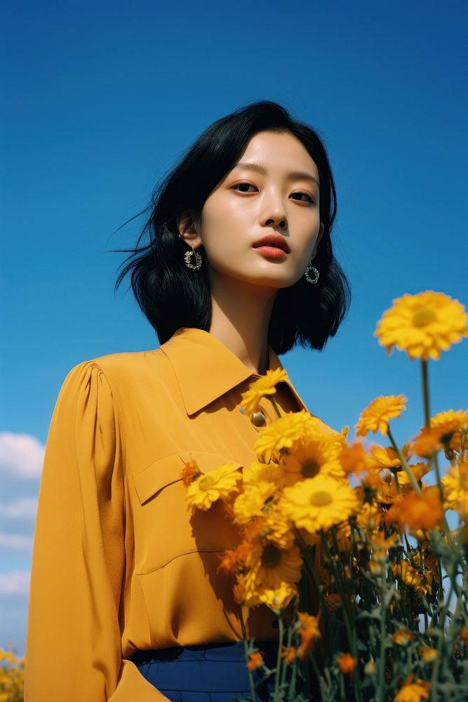 East Asian women beautiful flowers in a field portrait outdoors plant. AI generated Image by rawpixel.