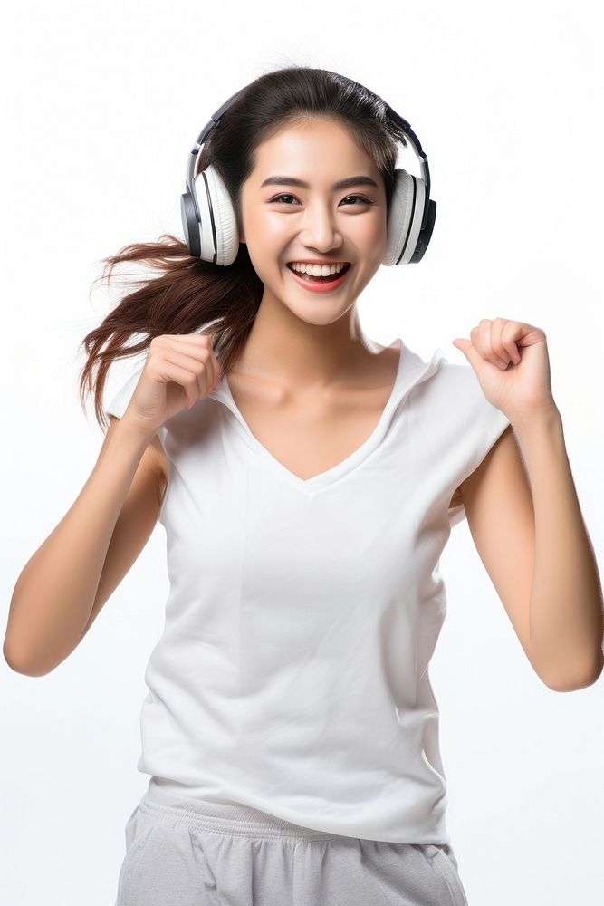 A Beautiful asean woman wearing gym clothes and headphones dancing happily and cheerful listening portrait headset. AI…