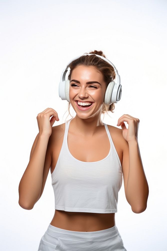 A Beautiful woman wearing gym clothes and headphones dancing happily and cheerful listening headset smiling. AI generated…