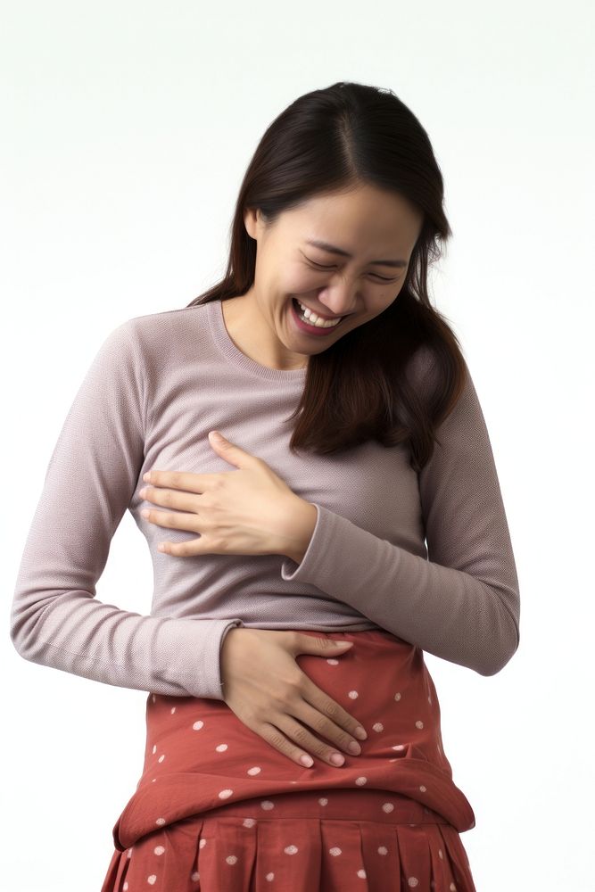 A woman touching her stomach happily smile adult white background. AI generated Image by rawpixel.