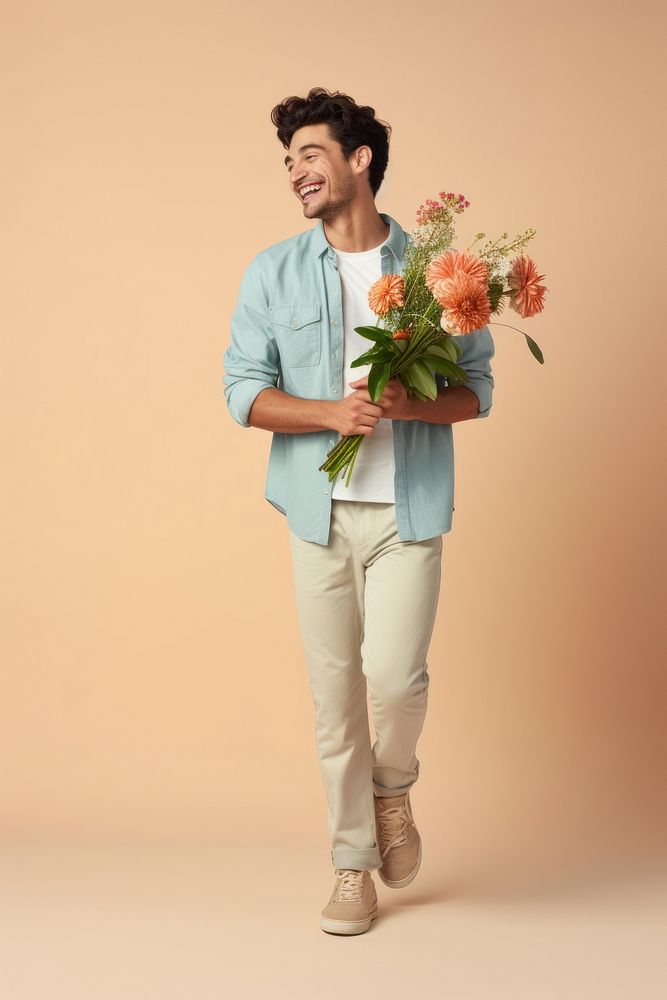 A happy man holding flowers standing portrait adult. AI generated Image by rawpixel.