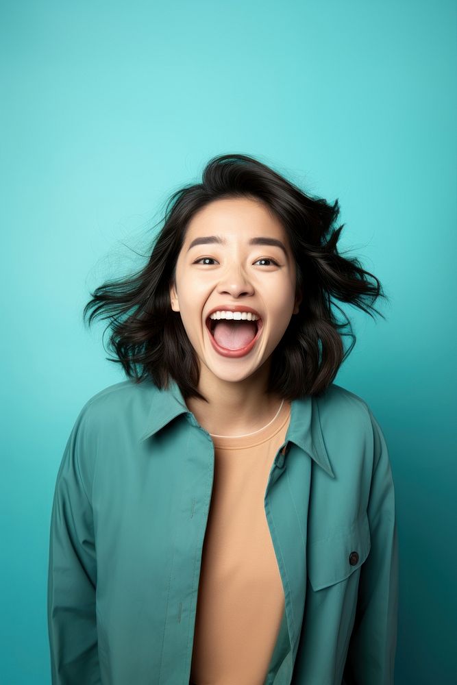 Asian woman surprise laughing smile. AI generated Image by rawpixel.