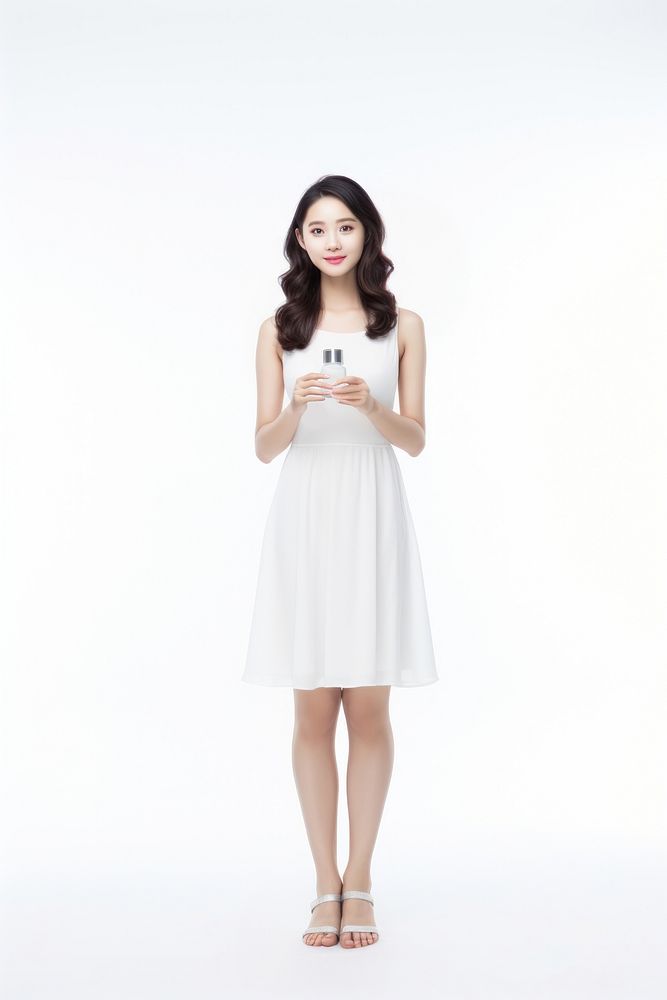 A Beautiful young asian woman with clean fresh skin holding a blanked small serum bottle portrait standing fashion. AI…