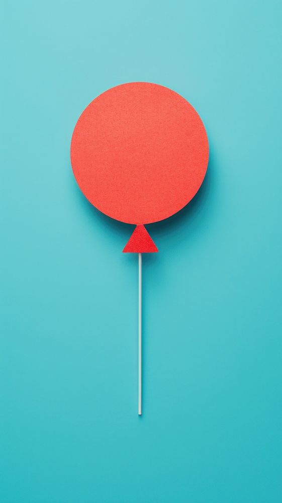 A red balloon confectionery lollipop yellow. AI generated Image by rawpixel.
