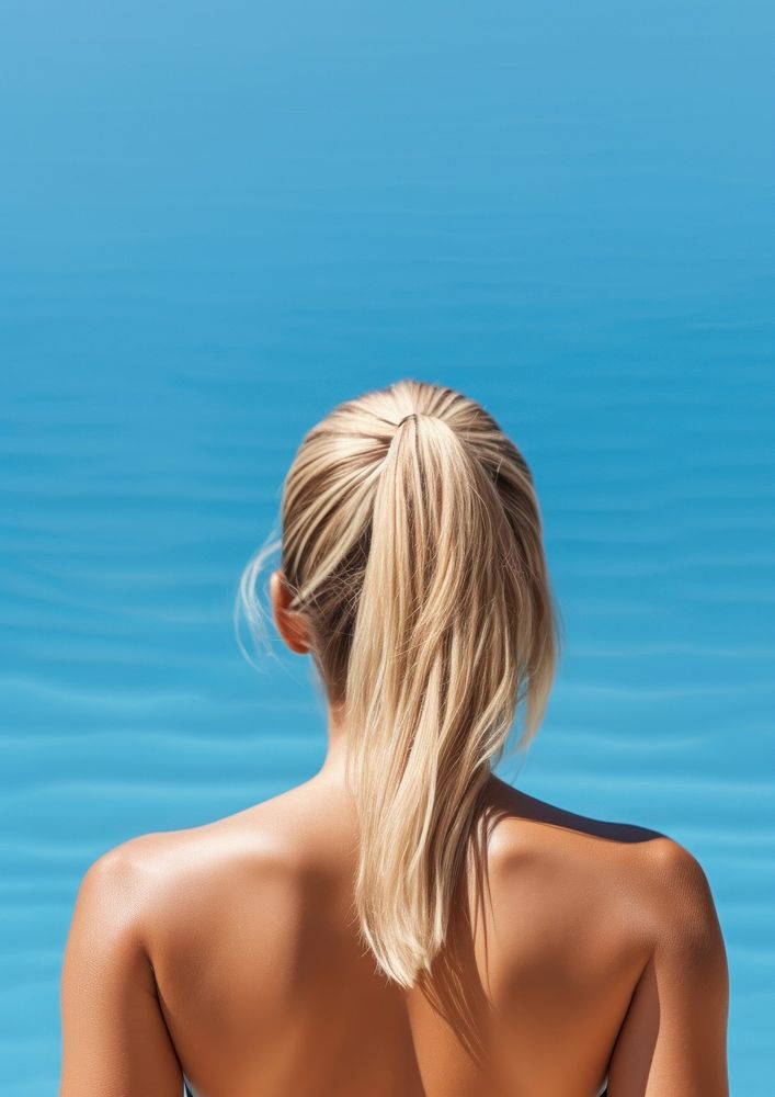 The back of a person wearing a swimming costume adult tranquility relaxation. 