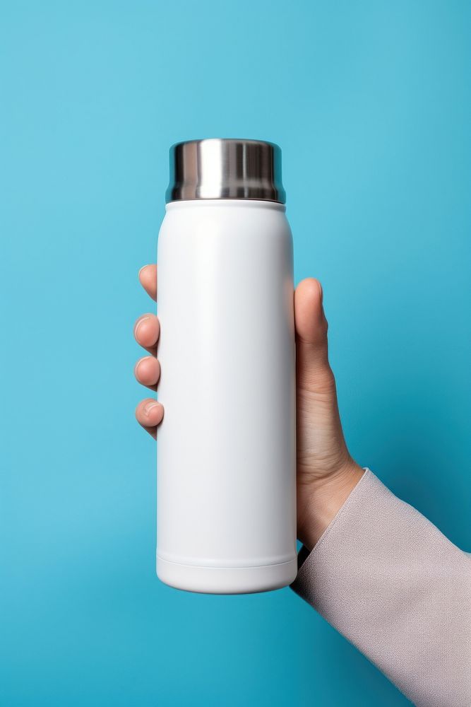 Thermal flask holding bottle hand. AI generated Image by rawpixel.