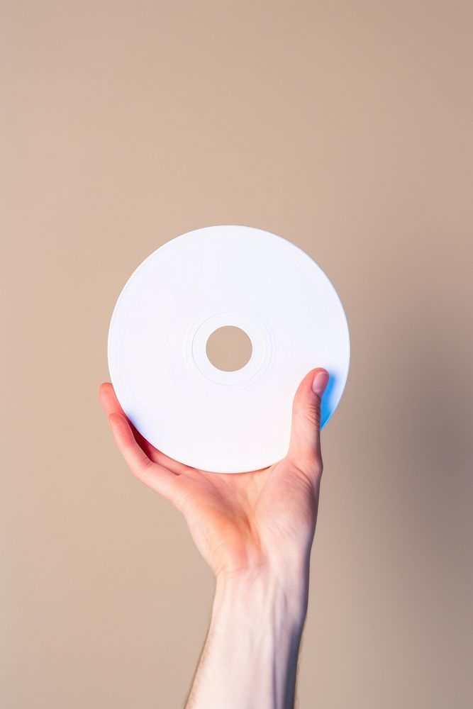 CD rom holding hand technology. AI generated Image by rawpixel.