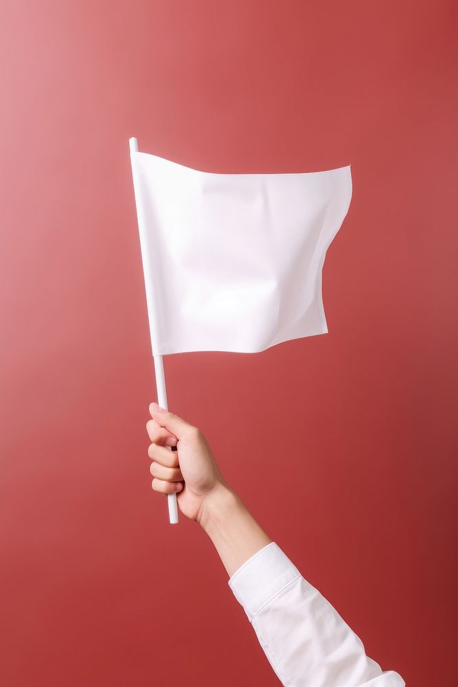 Flag holding white hand. 
