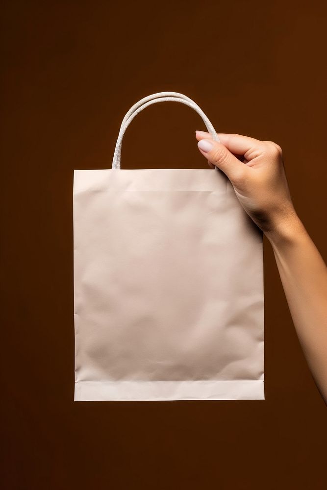 Paper bag handbag holding white. AI generated Image by rawpixel.