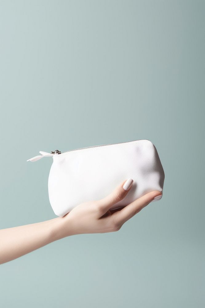 Pouch holding handbag white. AI generated Image by rawpixel.