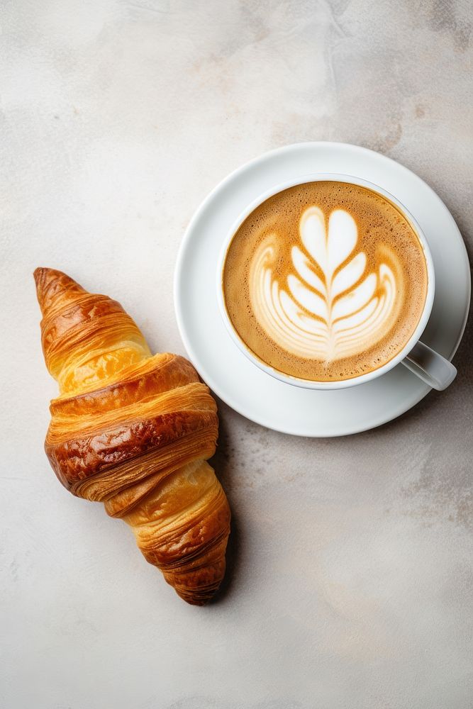 Hot latte art croissant food coffee. AI generated Image by rawpixel.