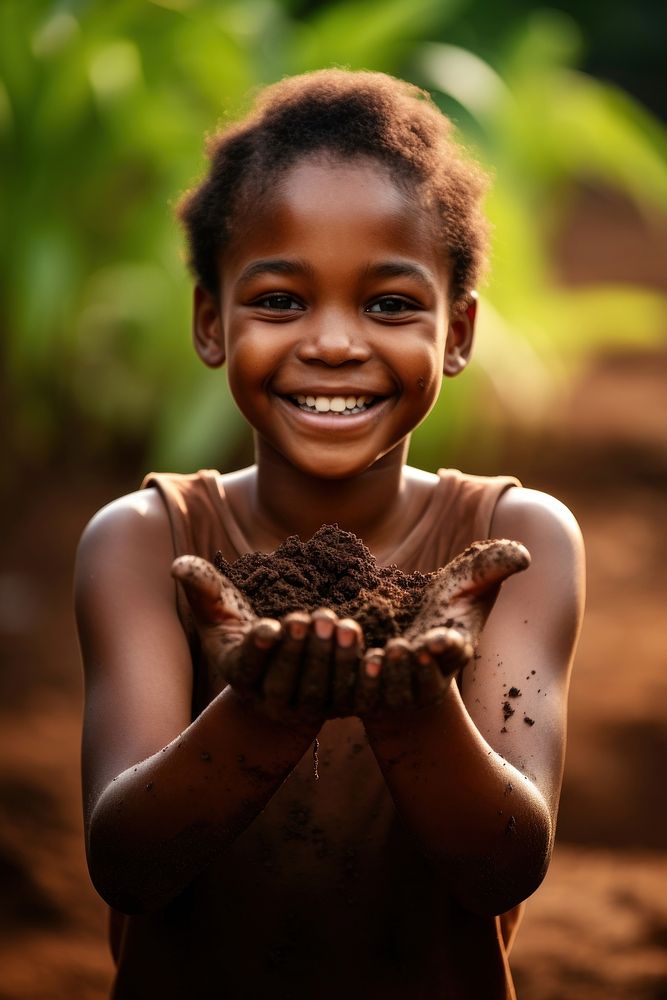 An African student kid child plant smile. AI generated Image by rawpixel.