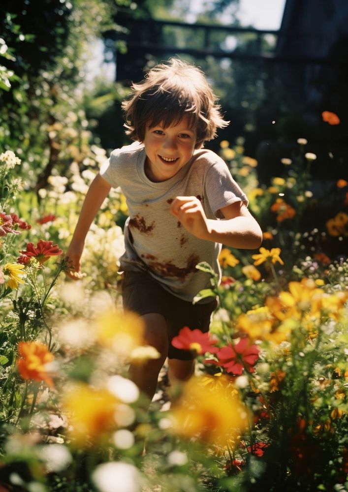 A kid running in the flower garden photography portrait outdoors. AI generated Image by rawpixel.