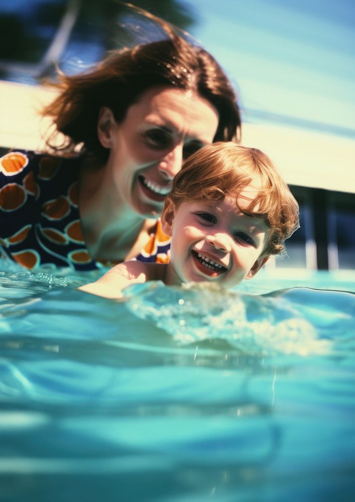 A kid swimming with her mother at the pool photography portrait outdoors. AI generated Image by rawpixel.