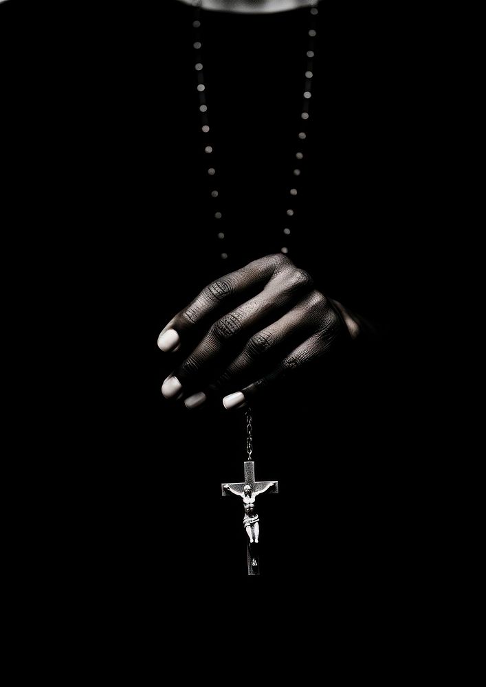 A hand praying with a cross black white accessories. AI generated Image by rawpixel.