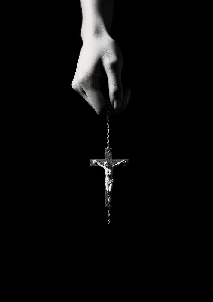 A hand holding a cross black white spirituality. AI generated Image by rawpixel.