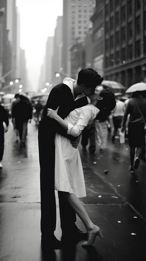 A couple kissing in the middle of the street in the city photography outdoors dancing. 
