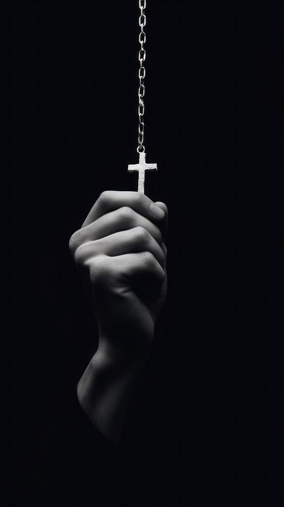 A hand holding a cross finger black white. AI generated Image by rawpixel.