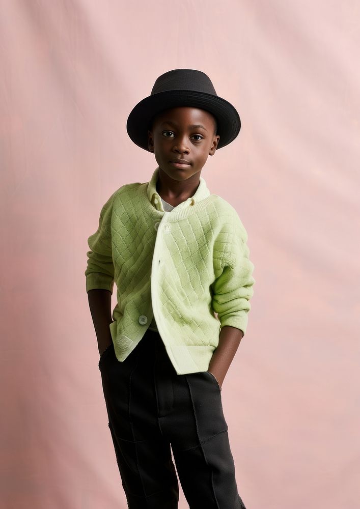 A black boy wearing hat sweater sleeve cute. AI generated Image by rawpixel.