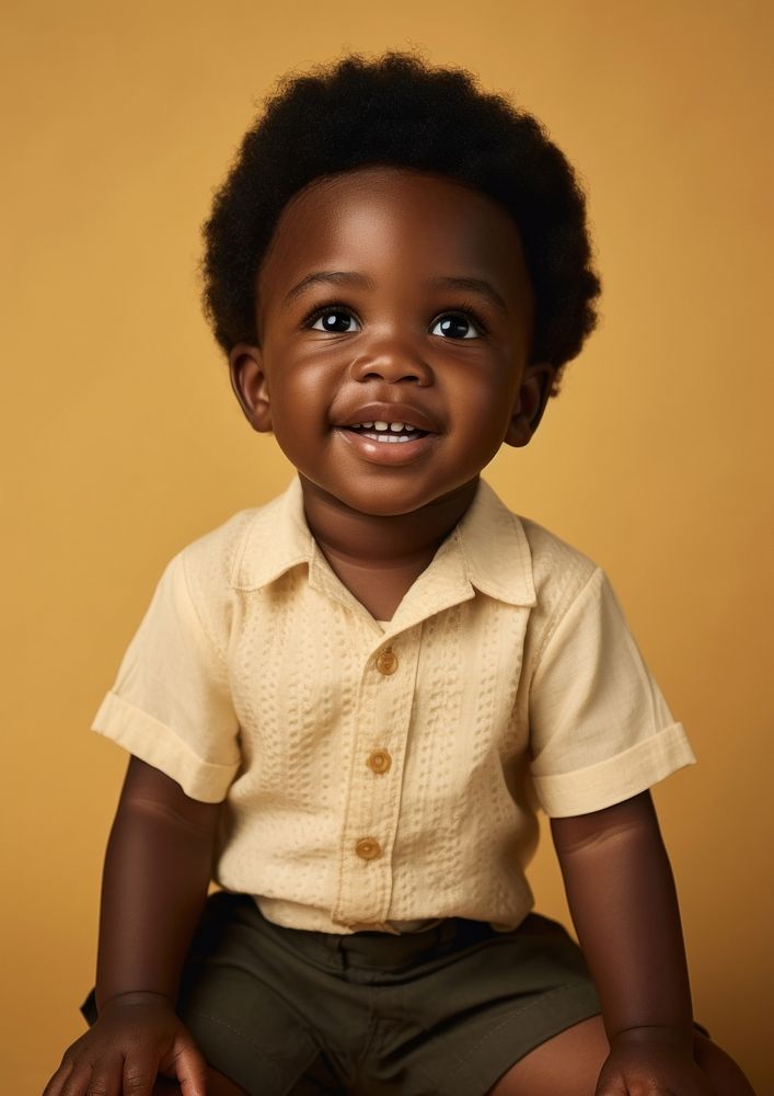A little black boy photography portrait smile. AI generated Image by rawpixel.