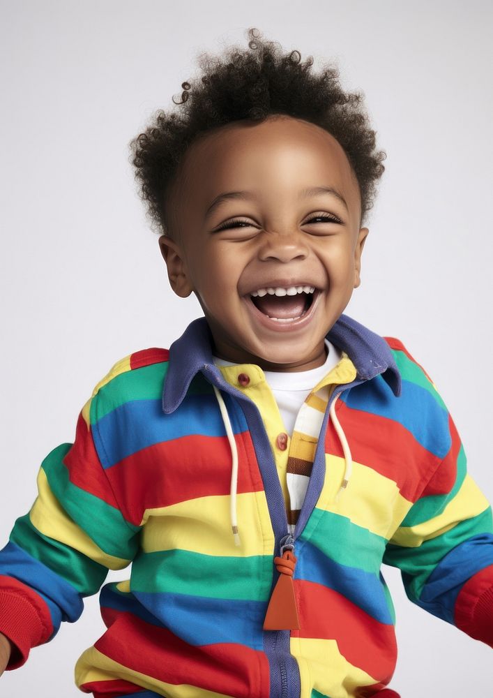 A little black boy in colorful outfit baby photography laughing. AI generated Image by rawpixel.