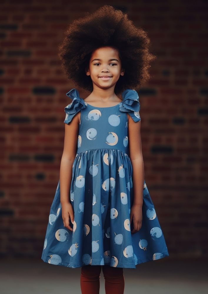 A little black girl wearing cute blue dress with moon pattern photography portrait child. AI generated Image by rawpixel.
