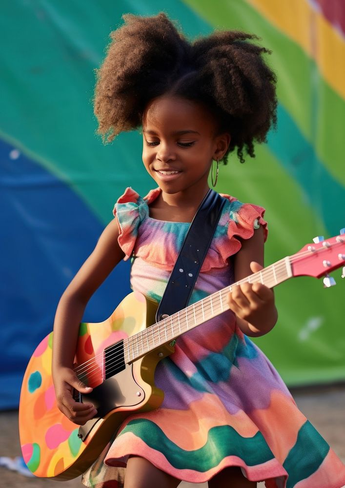 A little black girl wearing colorful dress and makeup playing guitar musician child cute. AI generated Image by rawpixel.