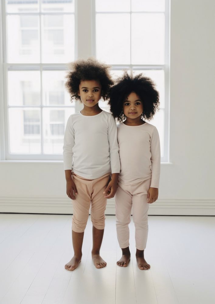 A little two black girl wearing pajama in the white room adult cute baby. AI generated Image by rawpixel.