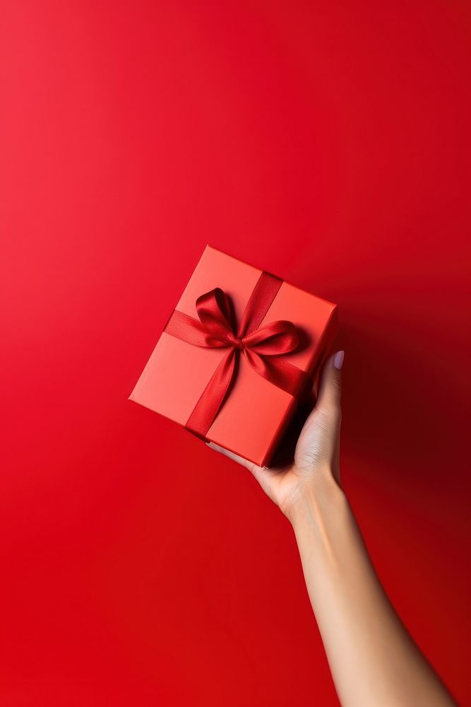 Gift box holding adult hand. AI generated Image by rawpixel.