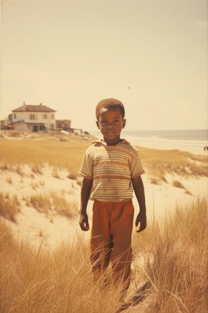 Kid on the beach portrait standing outdoors. AI generated Image by rawpixel.