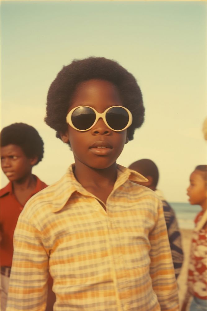 Kid on the beach sunglasses portrait outdoors. AI generated Image by rawpixel.