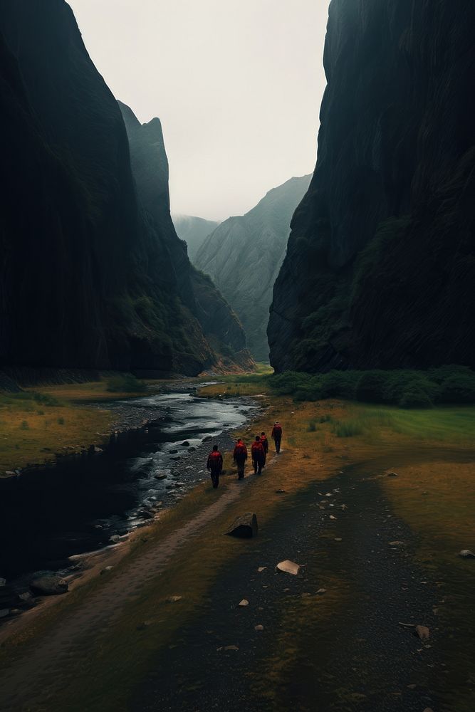 Hikers walking through the small river near mountains outdoors nature valley. AI generated Image by rawpixel.
