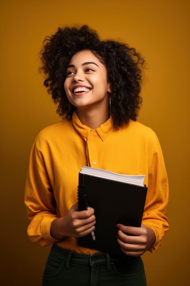 Student holding a book and pencil looking reading adult. AI generated Image by rawpixel.
