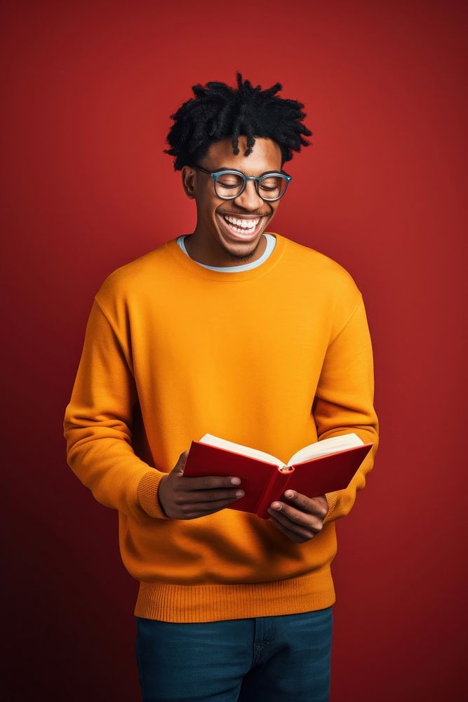 African american student holding a book portrait reading sweater. AI generated Image by rawpixel.