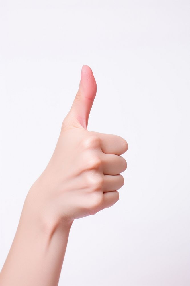A woman hand with thumb ups finger nail white background. AI generated Image by rawpixel.
