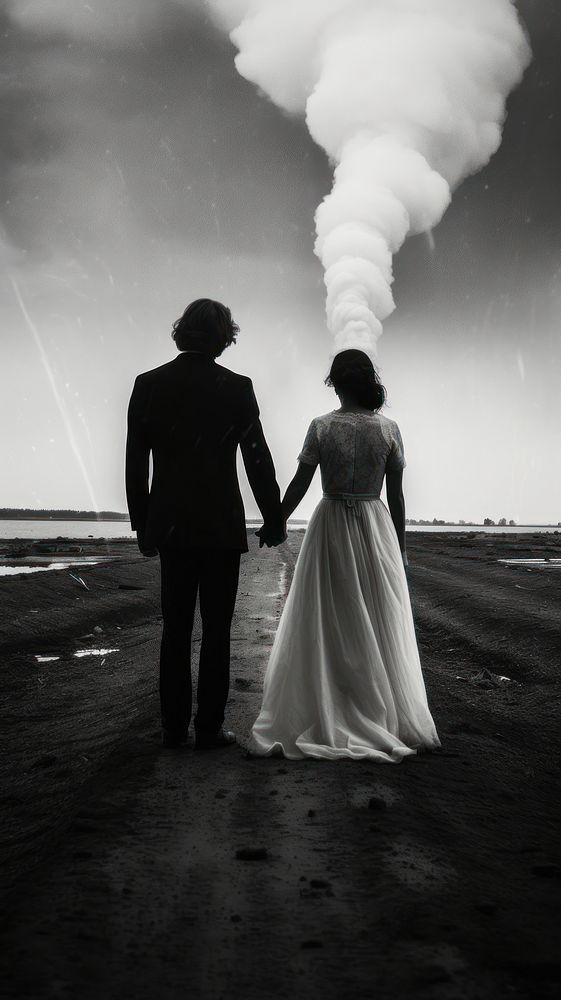A wedding couple holding hand while the tornado at the background photography silhouette outdoors. AI generated Image by…