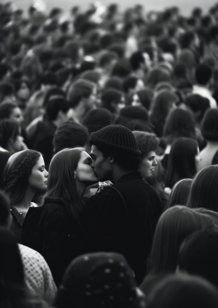 A couple kissing in the middle of a lot of people audience adult black. AI generated Image by rawpixel.