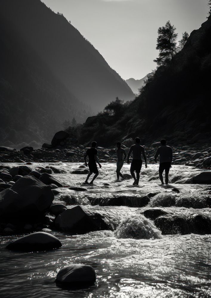 A group of people playing in the mountain river adventure outdoors walking. AI generated Image by rawpixel.