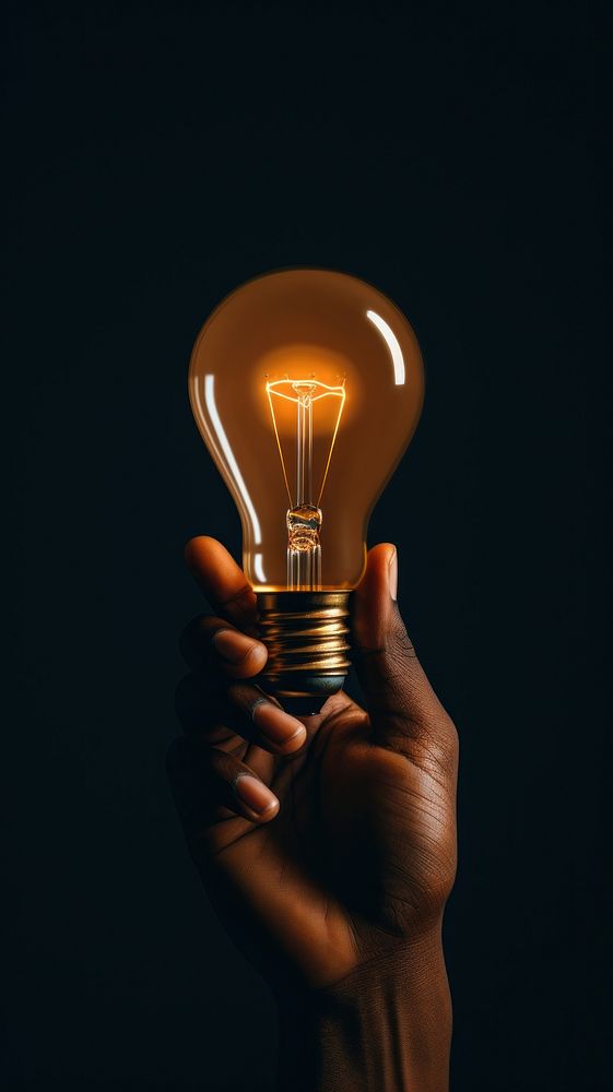 Hand hold light bulb lightbulb electricity illuminated. AI generated Image by rawpixel.
