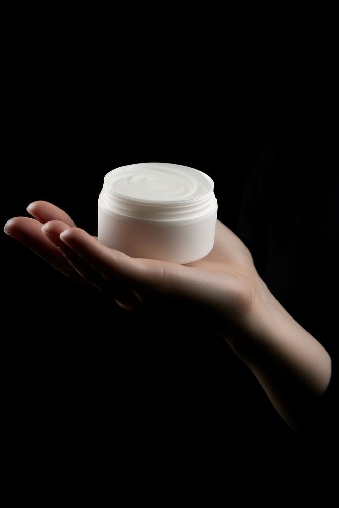 Cream container hand holding finger. AI generated Image by rawpixel.