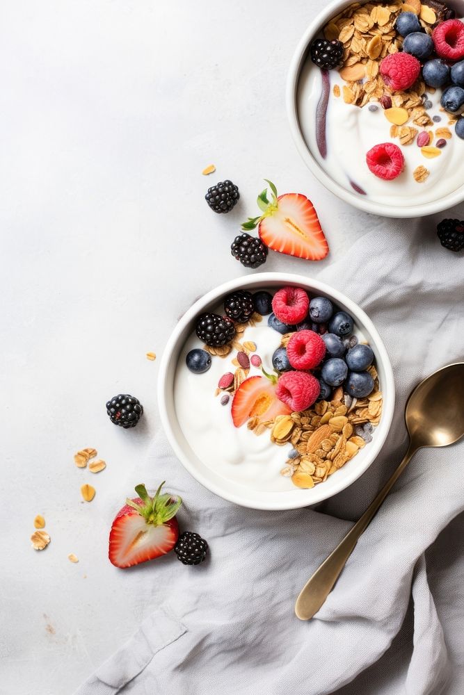 Yogurt bowl spoon granola dessert. AI generated Image by rawpixel.