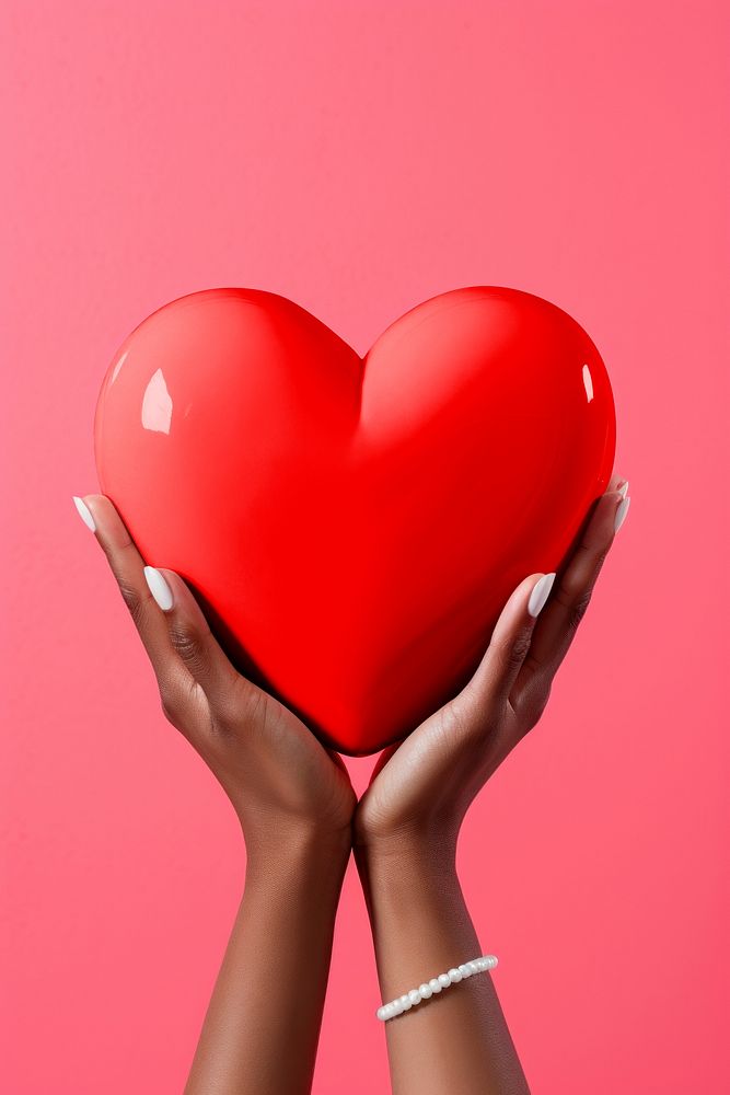 Heart mockup, held by hands psd