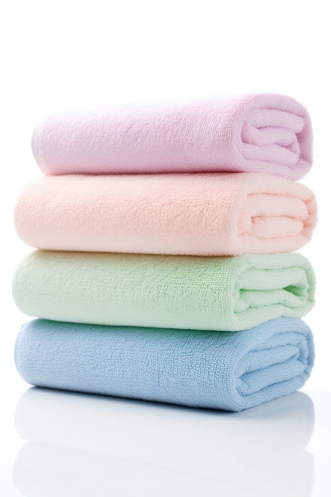 Rolled up towels white background softness textile. AI generated Image by rawpixel.