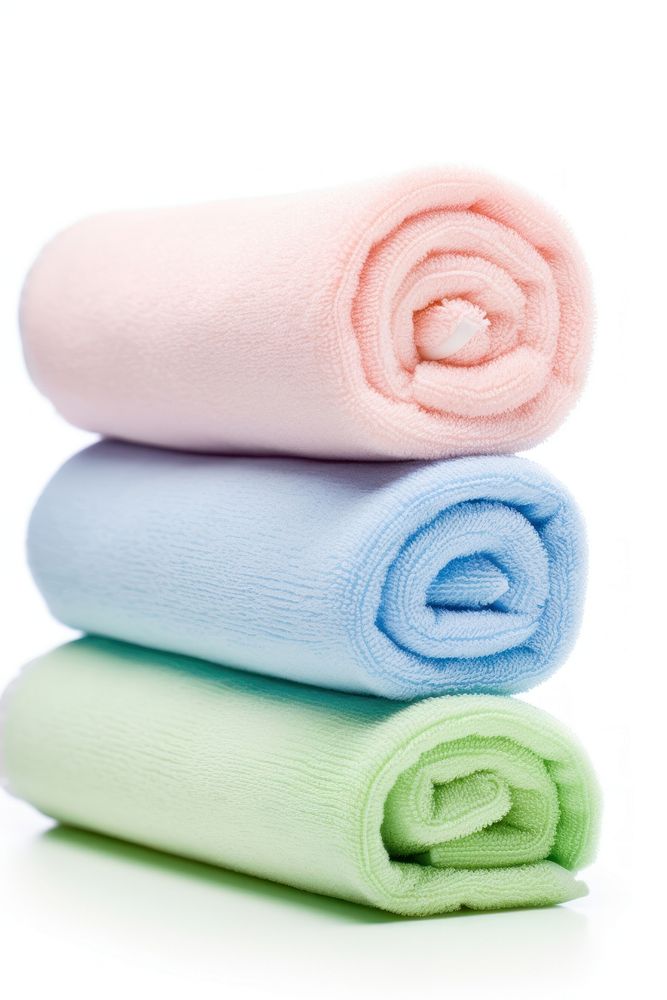 Rolled up towels white background relaxation softness. AI generated Image by rawpixel.