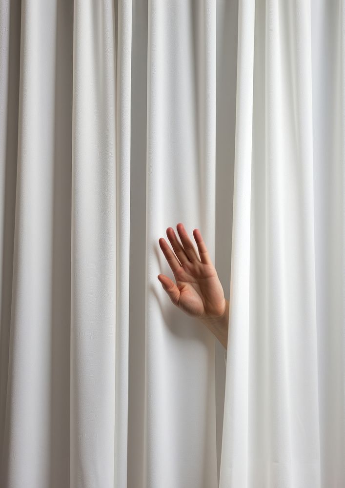 Hand opening a white curtain on stage finger gesturing touching. AI generated Image by rawpixel.