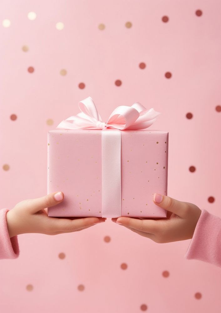 Polkadot gift box hand pink celebration. AI generated Image by rawpixel.
