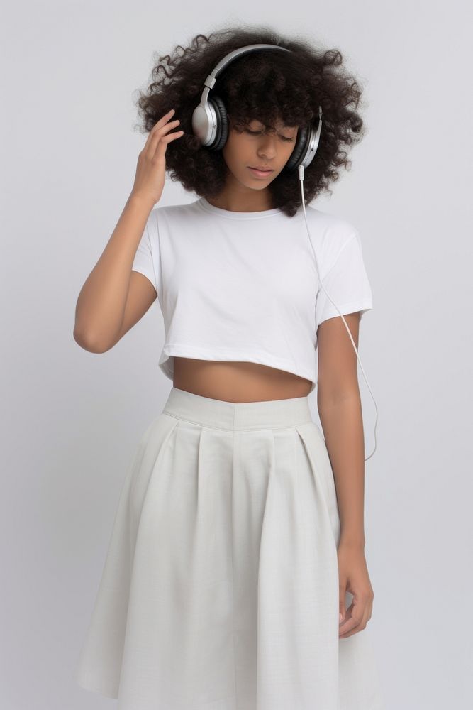 Mixed race woman headphones skirt sleeve. AI generated Image by rawpixel.
