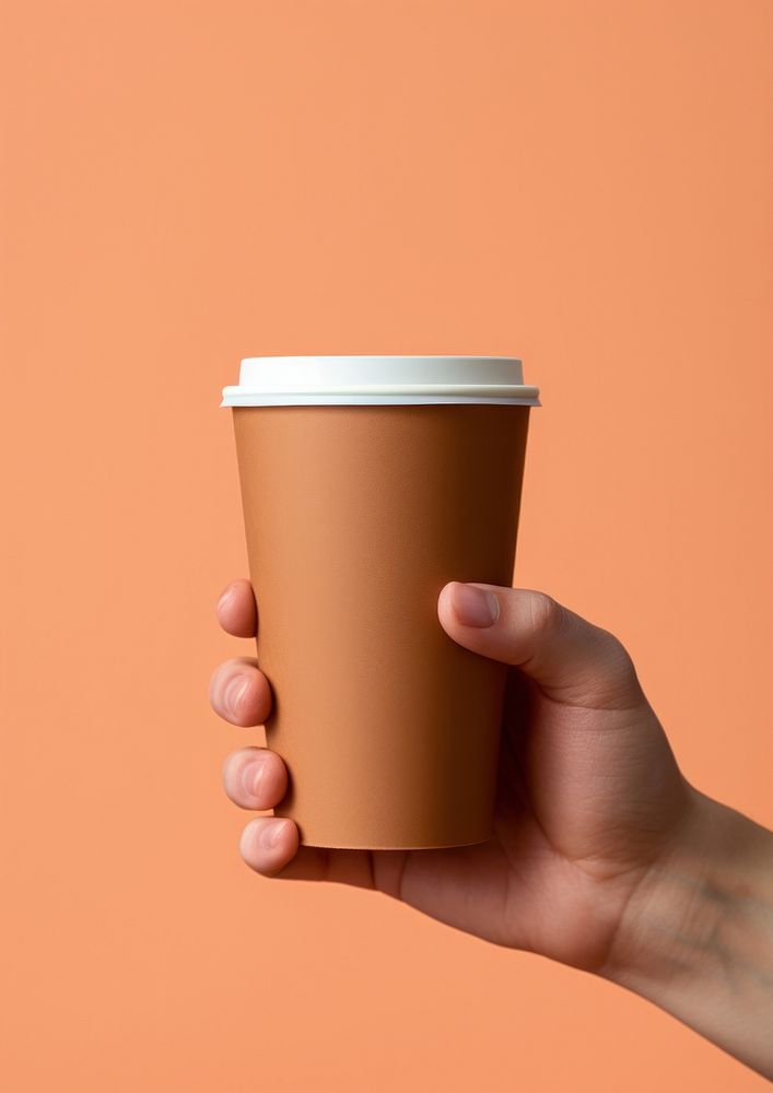 Brown coffee cup hand mug refreshment. AI generated Image by rawpixel.