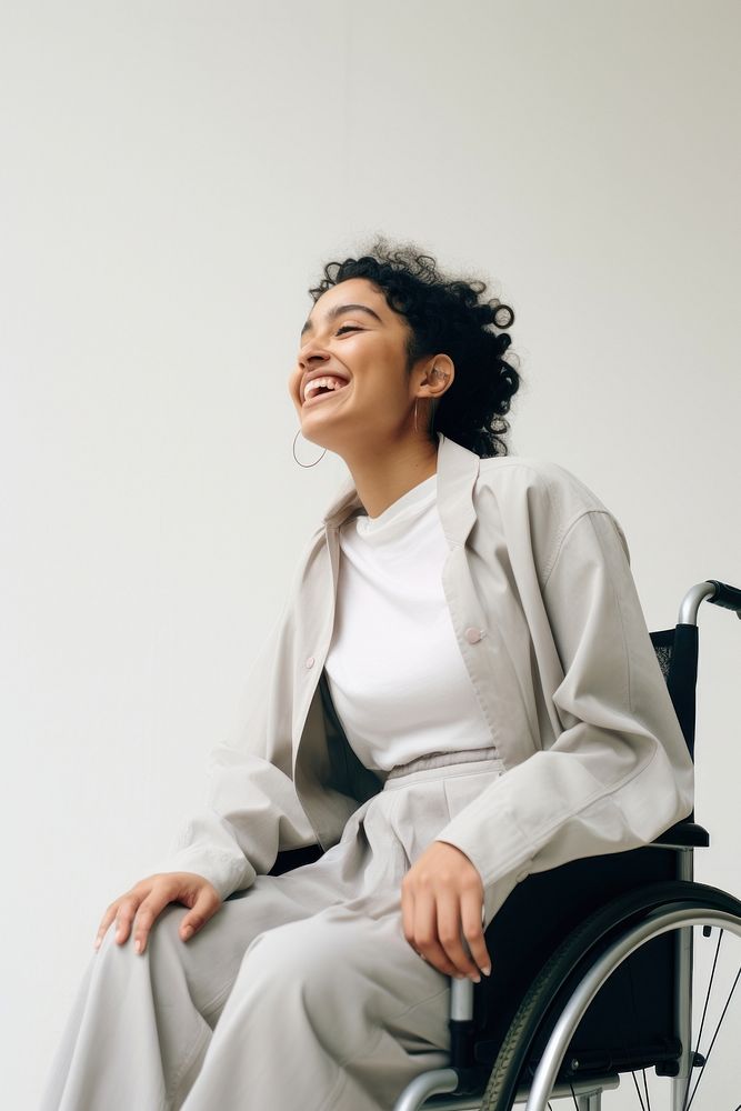 A disabled latinx woman wheelchair smiling adult. AI generated Image by rawpixel.