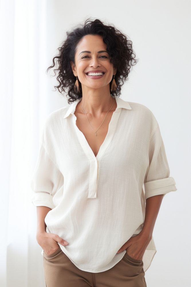 Middle age latin woman standing smiling blouse. AI generated Image by rawpixel.